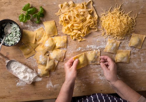 Woman making homemade pasta.